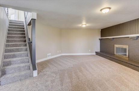 Living room after cleaning, with fresh carpet and clean walls